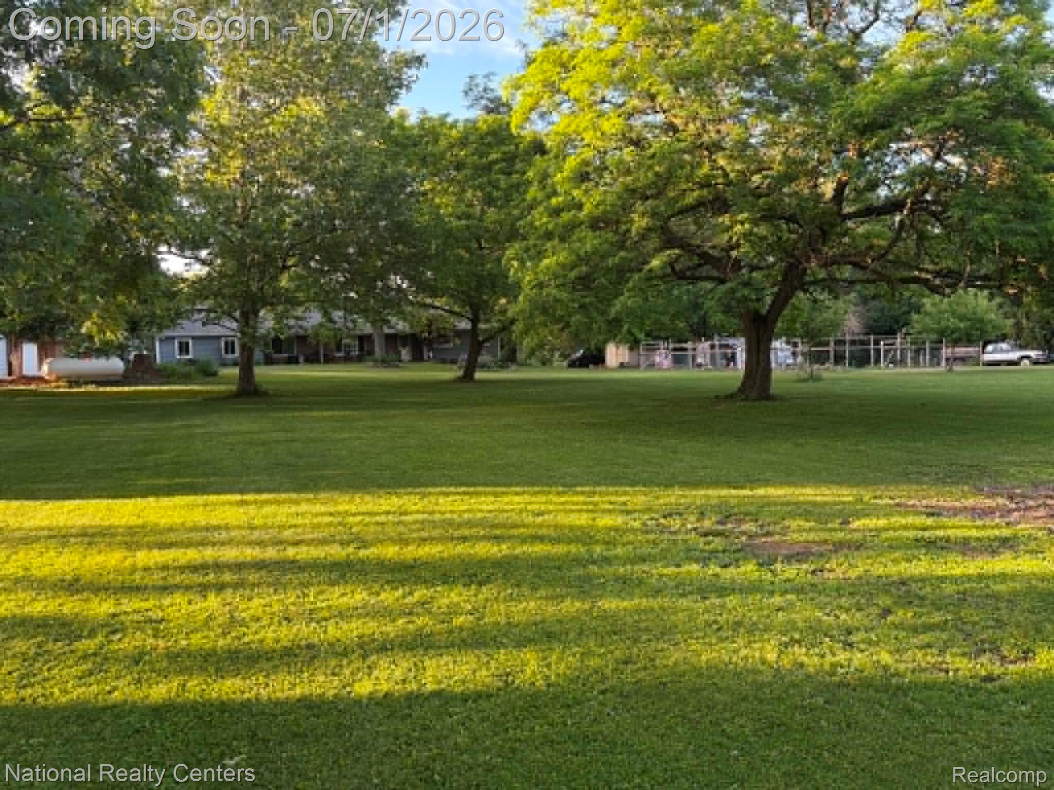 1330 Brauer Road Oxford, MI 48371 - Photo 9 of 54 Expansive lawn featuring mature trees and partial fencing