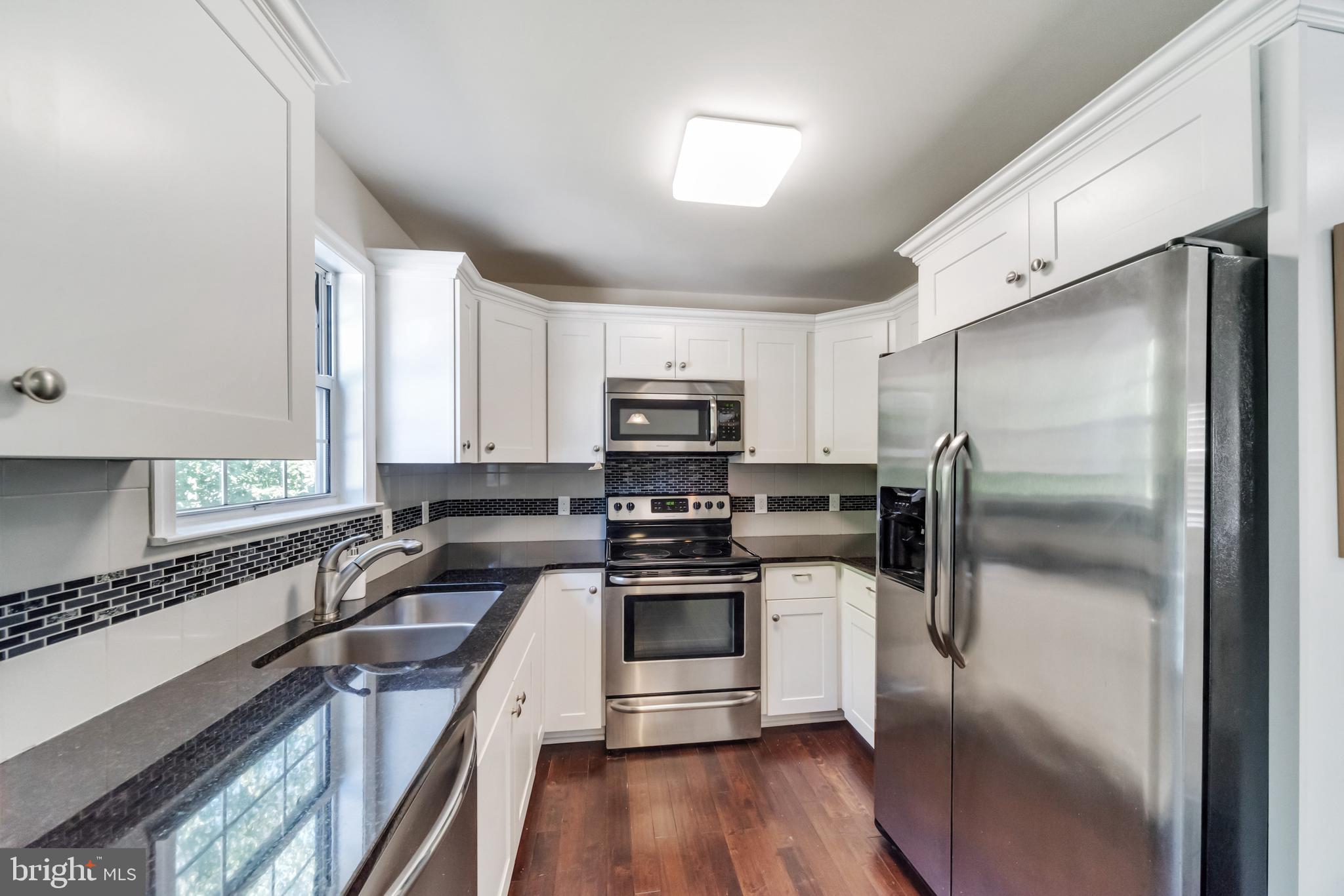 107 Ridge Avenue Taneytown, MD 21787 - Photo 8 of 34 Kitchen with granite counters