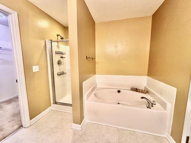 9801 Blackwell Drive Raleigh, NC 27617 - Photo 17 of 23 a bathroom with a bathtub and shower