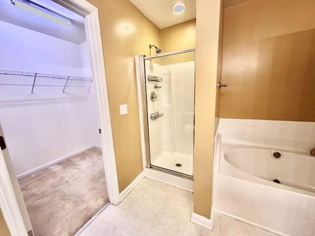 9801 Blackwell Drive Raleigh, NC 27617 - Photo 19 of 23 a bathroom with a bathtub and a shower
