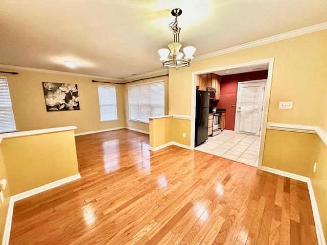 9801 Blackwell Drive Raleigh, NC 27617 - Photo 2 of 23 a view of a room with wooden floor and chandelier