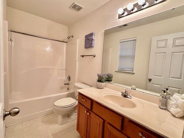9801 Blackwell Drive Raleigh, NC 27617 - Photo 22 of 23 a bathroom with a double vanity sink toilet mirror and shower