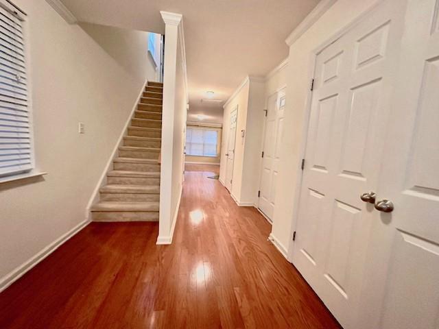 9801 Blackwell Drive Raleigh, NC 27617 - Photo 3 of 23 a view of a hallway with wooden floor and staircase
