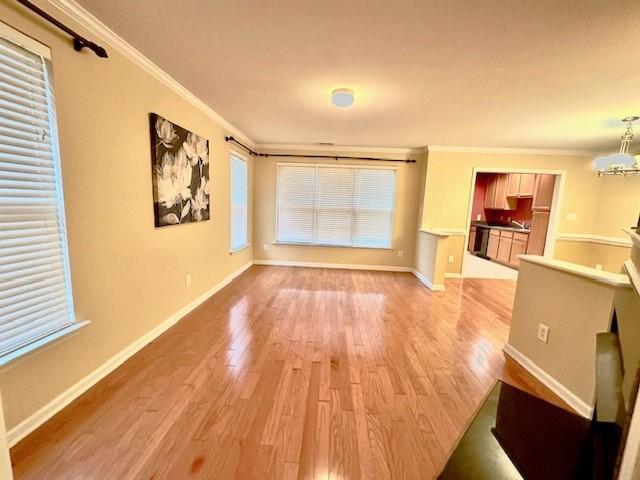 9801 Blackwell Drive Raleigh, NC 27617 - Photo 4 of 23 a view of a living room with wooden floor and a window