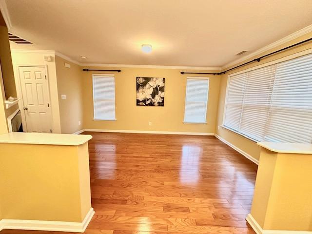 9801 Blackwell Drive Raleigh, NC 27617 - Photo 6 of 23 a view of a room with wooden floor and a window