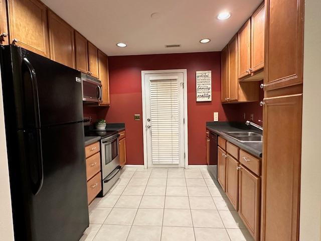 9801 Blackwell Drive Raleigh, NC 27617 - Photo 9 of 23 a kitchen with stainless steel appliances granite countertop a refrigerator and a stove