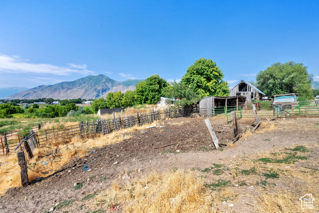 1632 South Main Street Springville, UT 84663 - Photo 51 of 93 View of yard featuring an outdoor structure, an exterior structure, a view of rural / pastoral area, and a mountain view