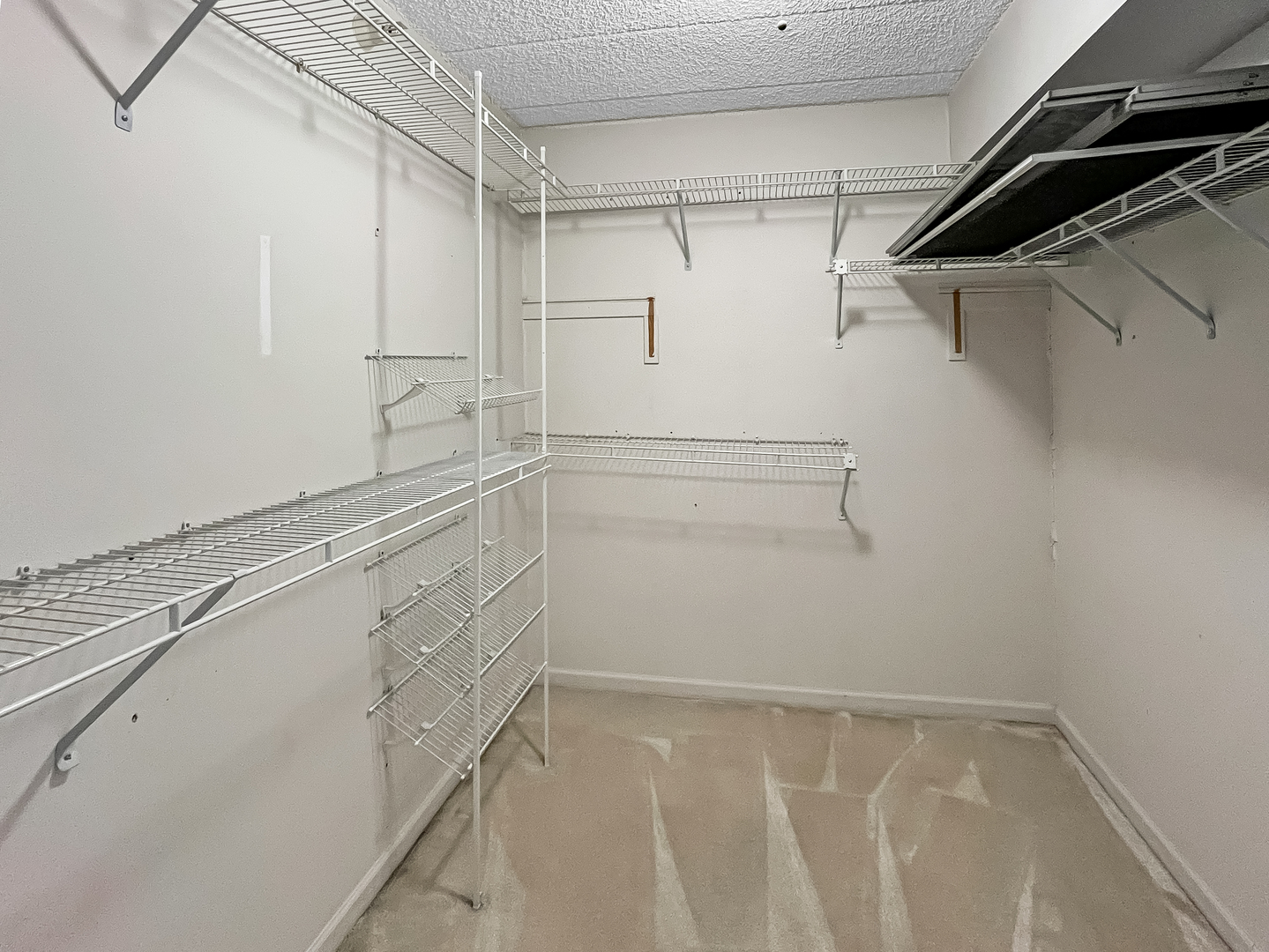 3640 186th Street, Unit 201 Lansing, IL 60438 - Photo 12 of 21 a view of a room with racks on the wall