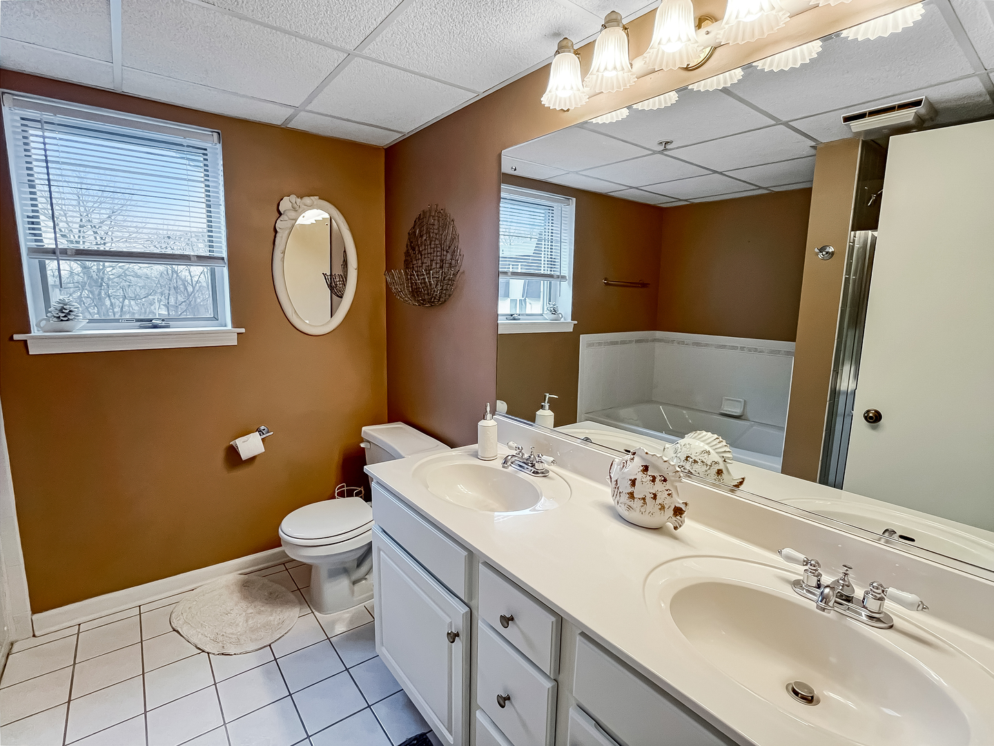 3640 186th Street, Unit 201 Lansing, IL 60438 - Photo 13 of 21 a bathroom with a sink and a mirror