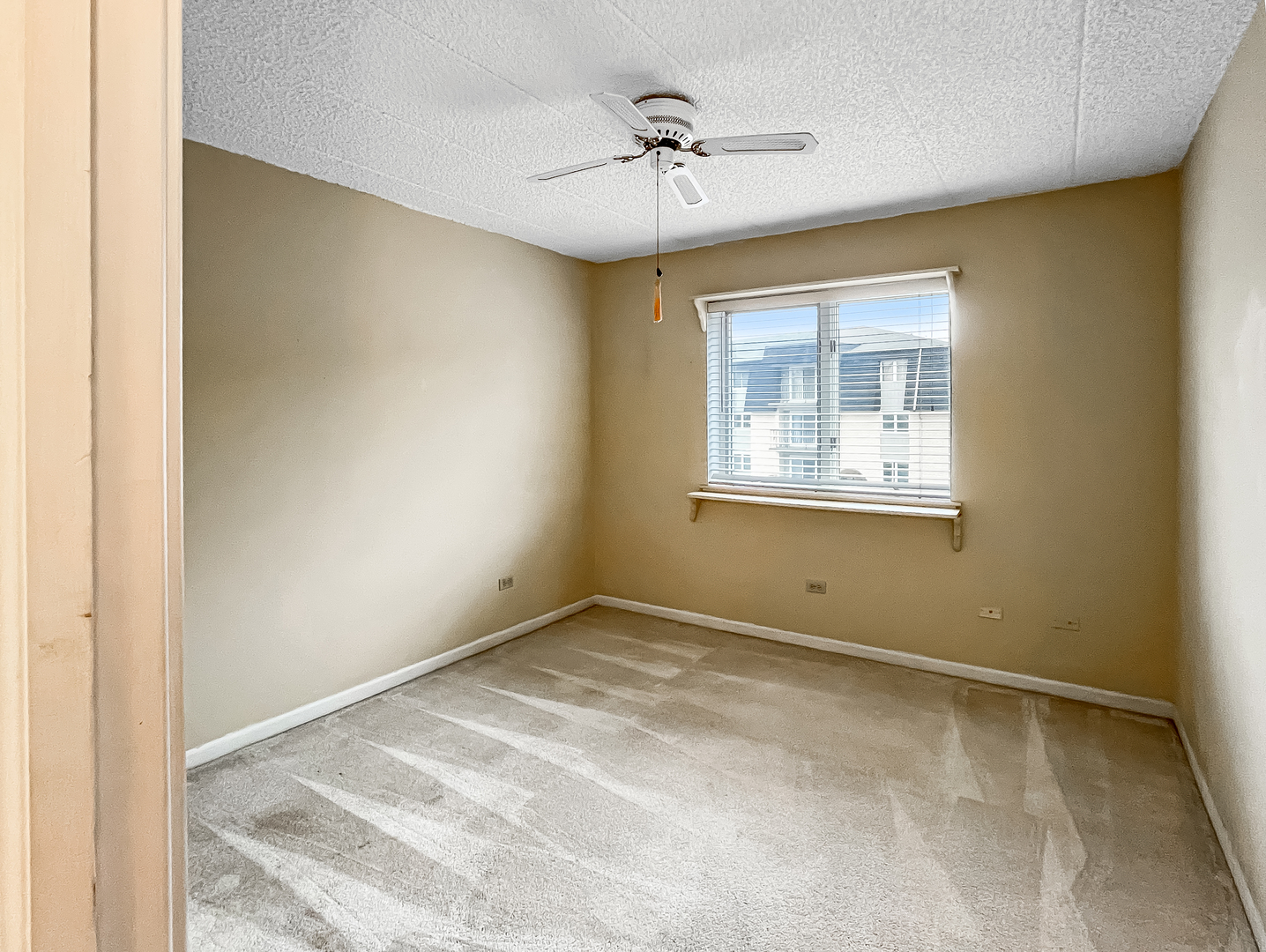 3640 186th Street, Unit 201 Lansing, IL 60438 - Photo 15 of 21 a view of an empty room with a window