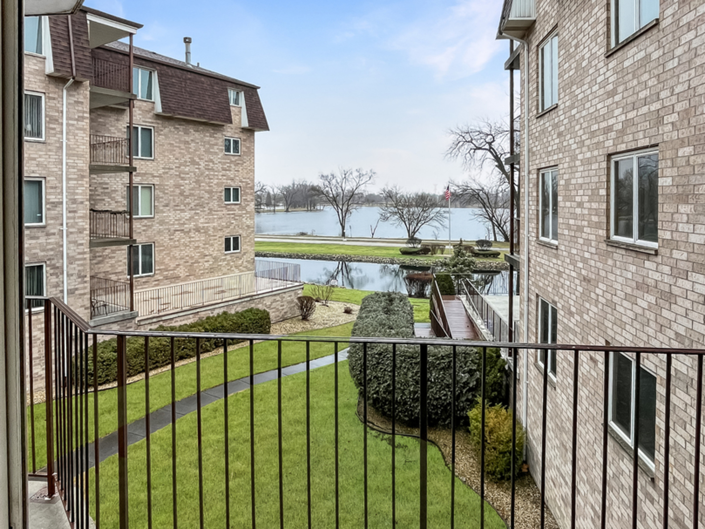 3640 186th Street, Unit 201 Lansing, IL 60438 - Photo 20 of 21 a balcony with view of swimming pool