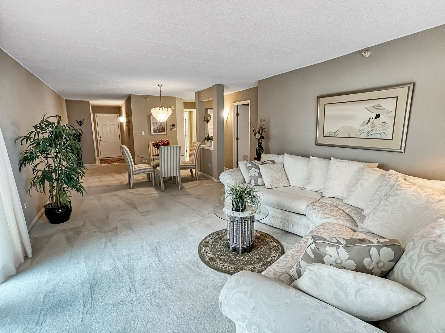 3640 186th Street, Unit 201 Lansing, IL 60438 - Photo 4 of 21 a living room with furniture and a potted plant
