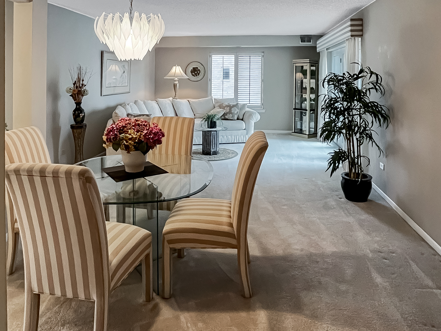 3640 186th Street, Unit 201 Lansing, IL 60438 - Photo 6 of 21 a view of a dining room with furniture and chandelier