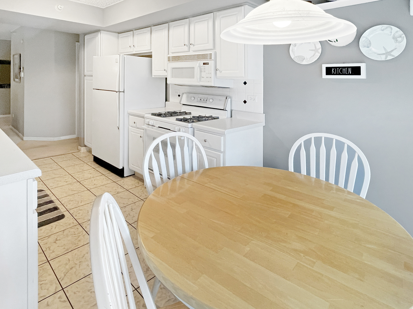 3640 186th Street, Unit 201 Lansing, IL 60438 - Photo 9 of 21 a bedroom with a bed and white cabinets