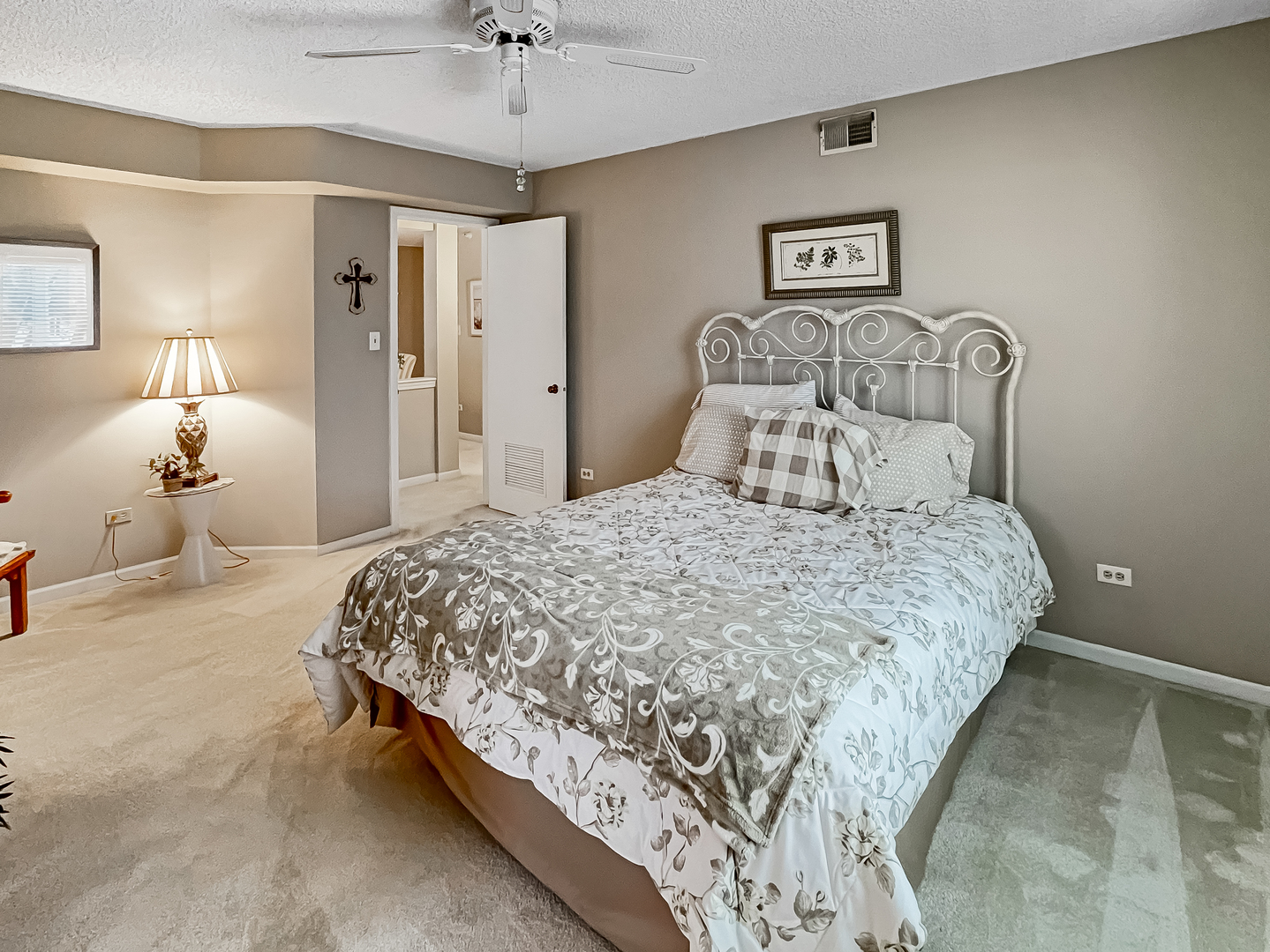 3640 186th Street, Unit 201 Lansing, IL 60438 - Photo 10 of 21 a bedroom with a bed and ceiling fan
