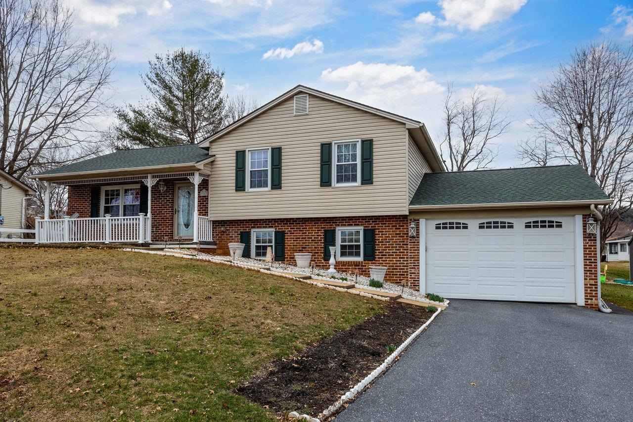 58 Rolla Mill Road Verona, VA 24482 - Photo 1 of 46 a front view of a house with a yard and garage