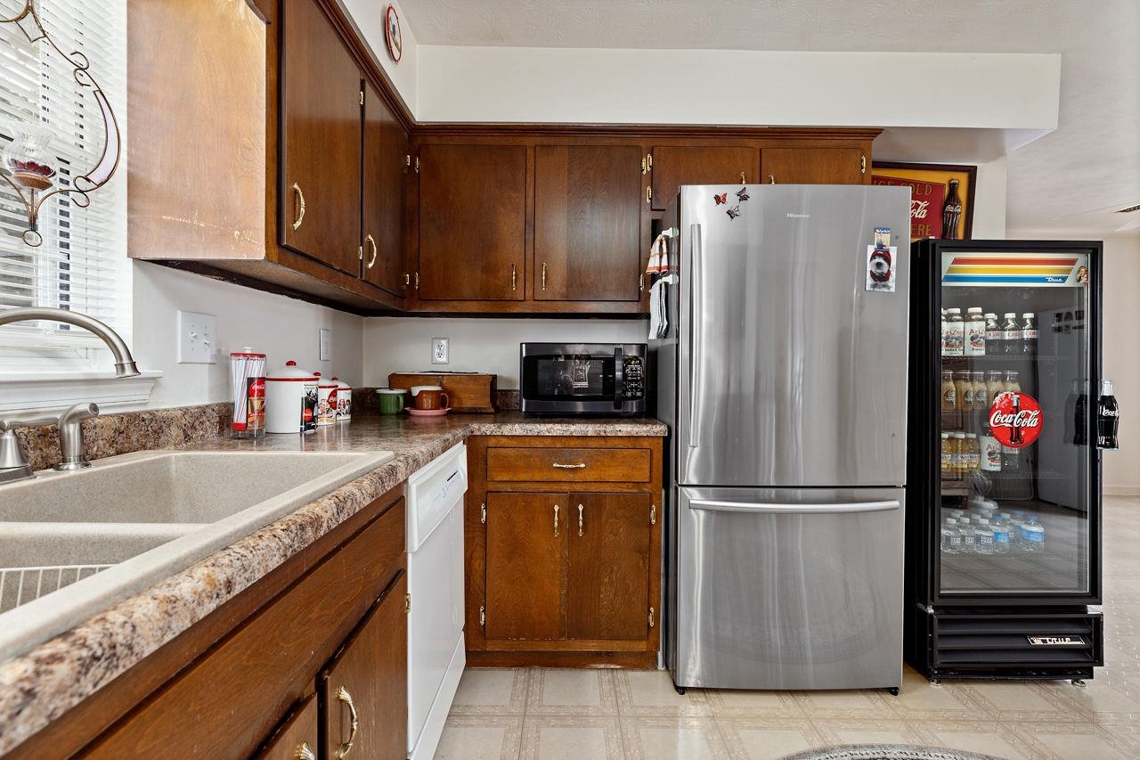 58 Rolla Mill Road Verona, VA 24482 - Photo 30 of 46 a kitchen with stainless steel appliances granite countertop a refrigerator and a sink