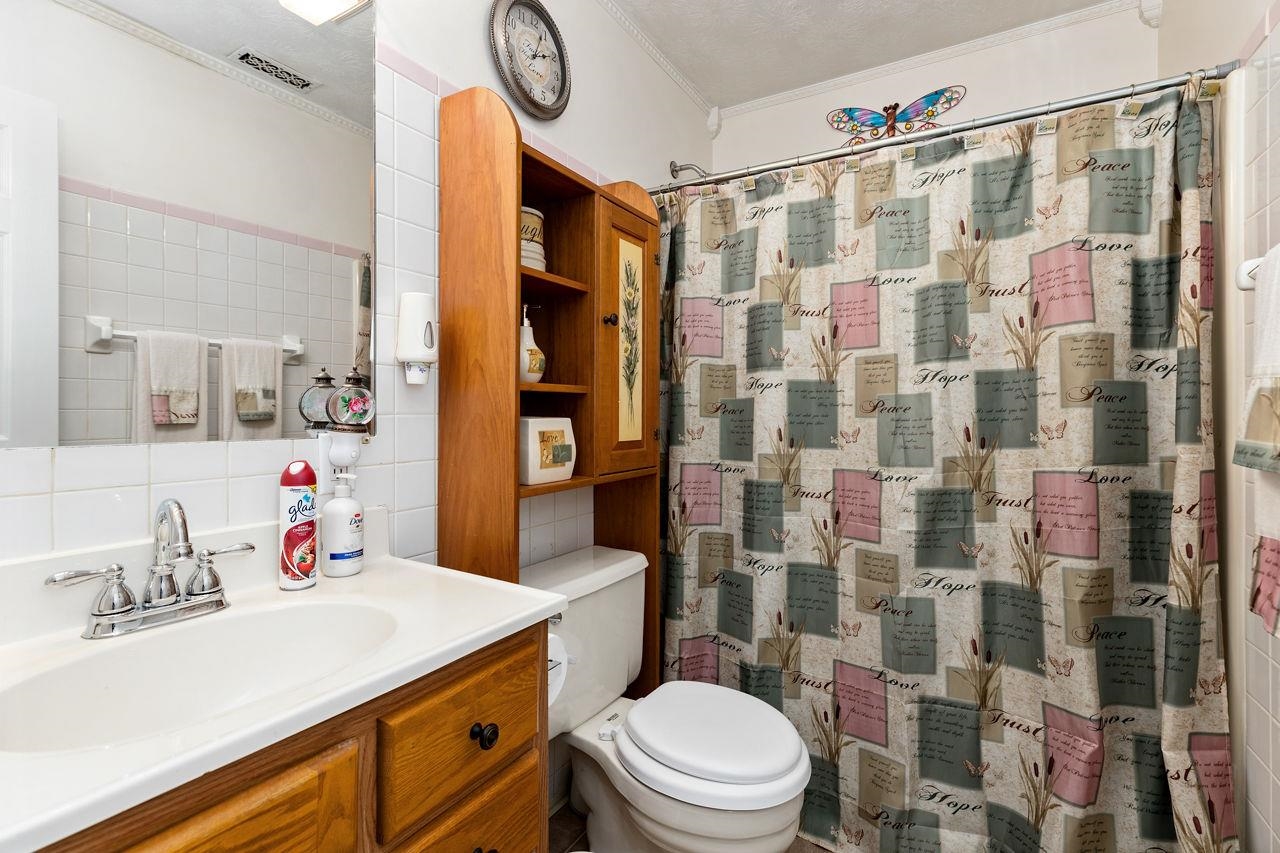 58 Rolla Mill Road Verona, VA 24482 - Photo 41 of 46 a bathroom with a sink vanity mirror and toilet