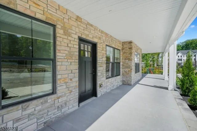 a view of a brick house with a large windows