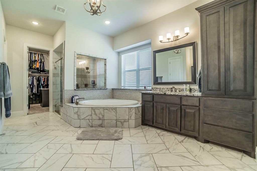 1420 Ashton Ridge Drive Prosper, TX 75078 - Photo 15 of 39 a spacious bathroom with a tub sink and mirror