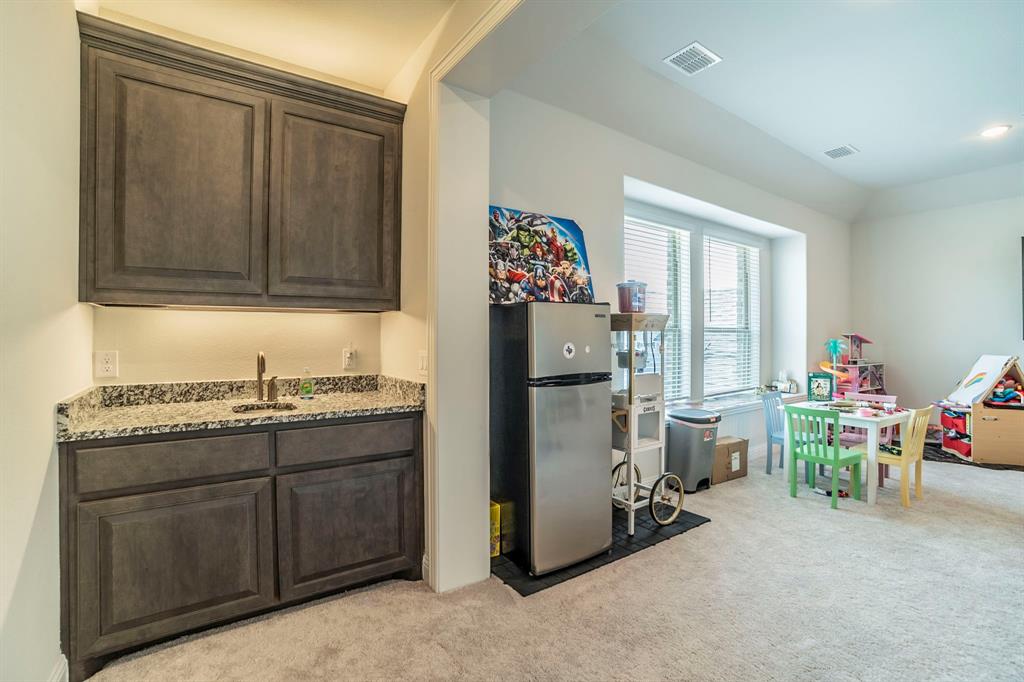 1420 Ashton Ridge Drive Prosper, TX 75078 - Photo 22 of 39 a room with furniture and a window