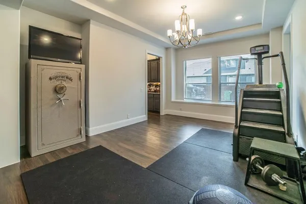 wooden floor with windows and entryway