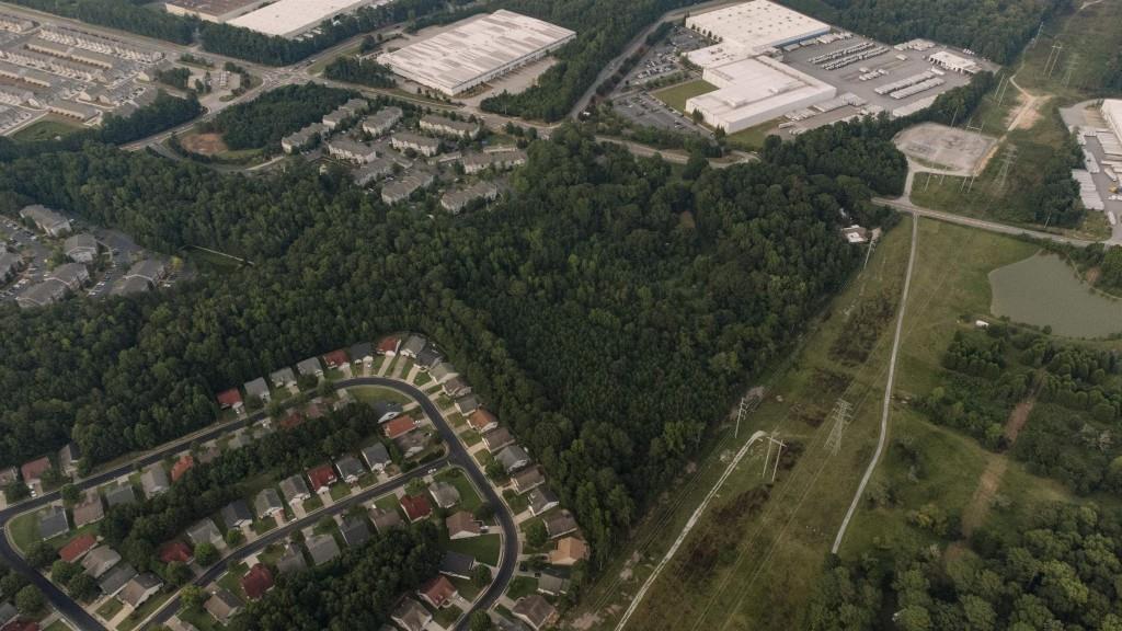 Undisclosed Address Fairburn, GA 30213 - Photo 2 of 5 an aerial view of residential houses with outdoor space