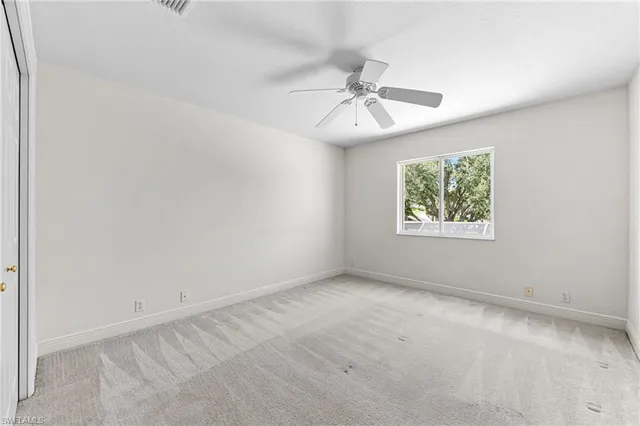 a bathroom with a bathtub shower sink vanity mirror and toilet