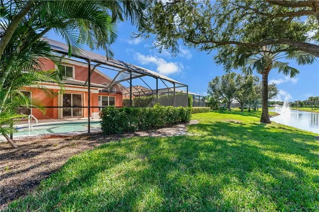 a sign board with tall trees