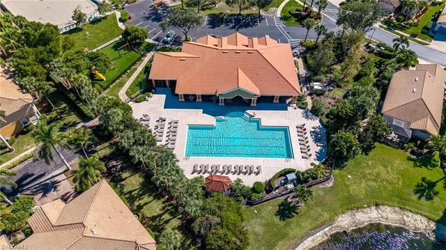 an aerial view of a house with a garden and trees