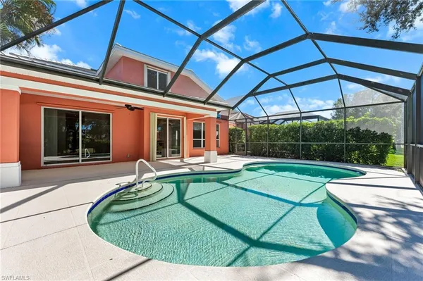 a view of a house with backyard porch and sitting area