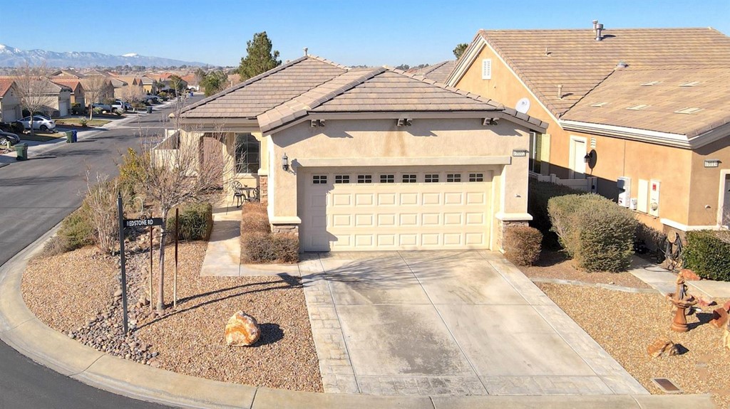 10002 Redstone Road Apple Valley, CA 92308 - Photo 1 of 1 a view of a house with a bath tub