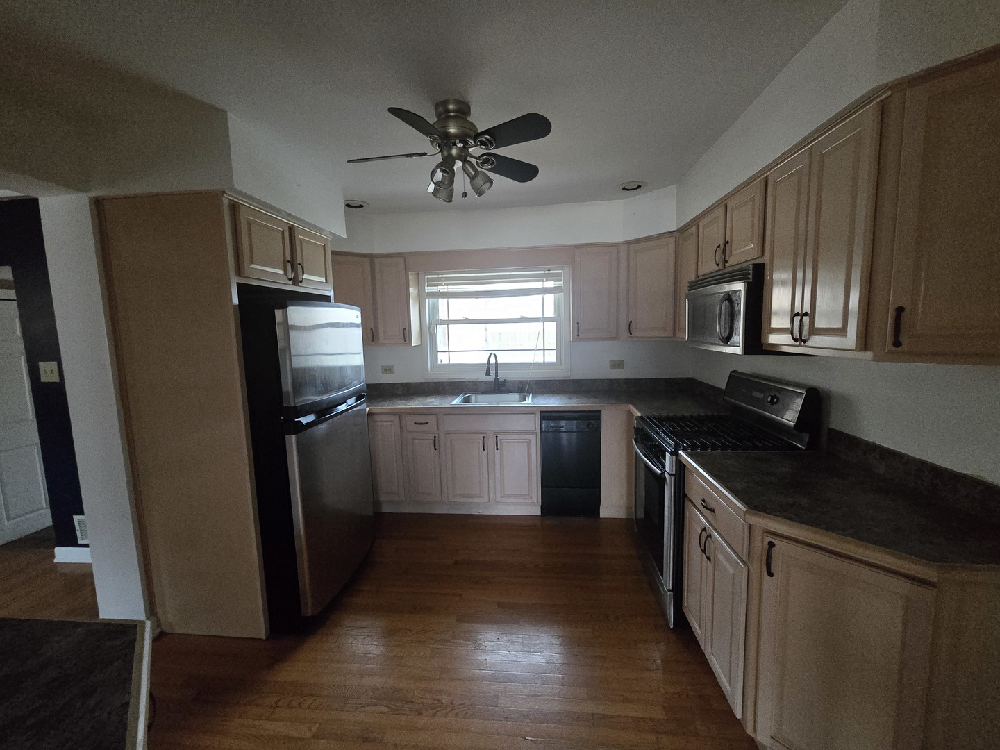 6108 Birmingham Street Chicago Ridge, IL 60415 - Photo 5 of 19 a kitchen with a sink appliances and cabinets