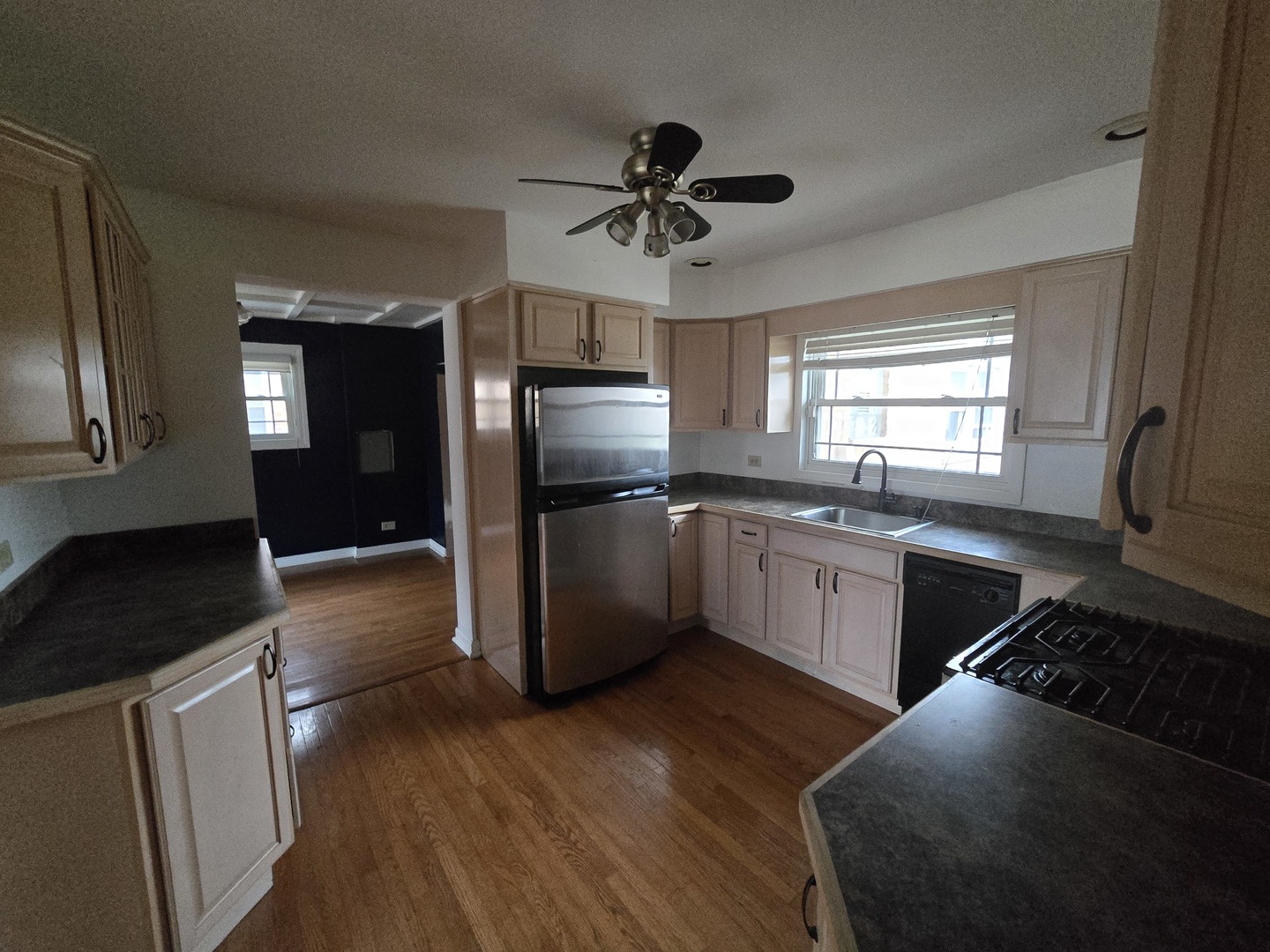 6108 Birmingham Street Chicago Ridge, IL 60415 - Photo 6 of 19 a kitchen with a refrigerator cabinets and wooden floor