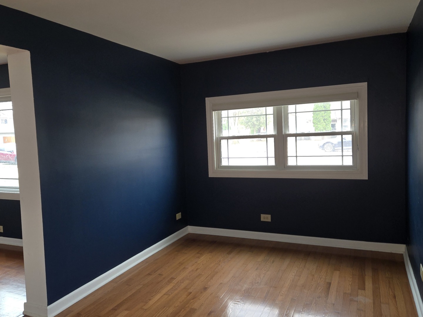 6108 Birmingham Street Chicago Ridge, IL 60415 - Photo 9 of 19 a view of an empty room with wooden floor and a window