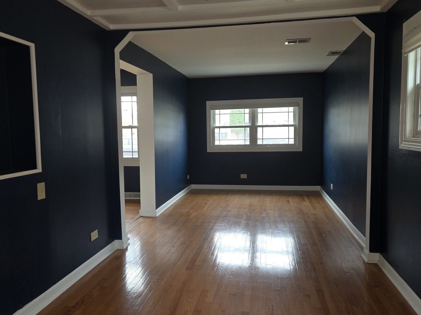 6108 Birmingham Street Chicago Ridge, IL 60415 - Photo 10 of 19 an empty room with wooden floor and windows