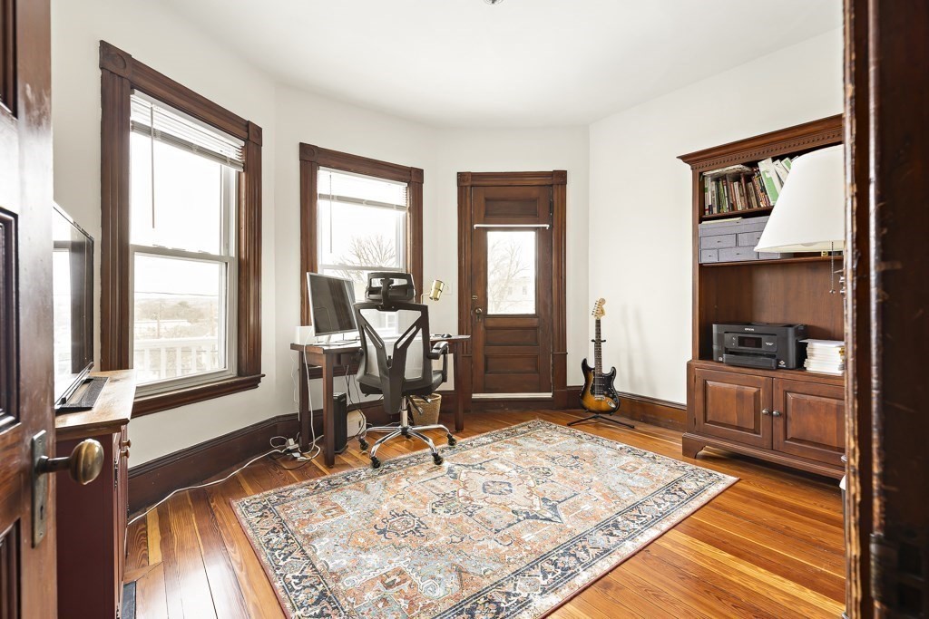 55 Main Street Somerville, MA 02145 - Photo 4 of 28 a work room with furniture and a window