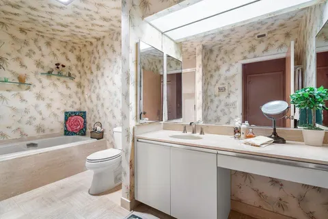 a bathroom with a bathtub and shower