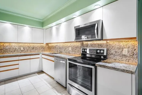 a kitchen with a stove and a sink
