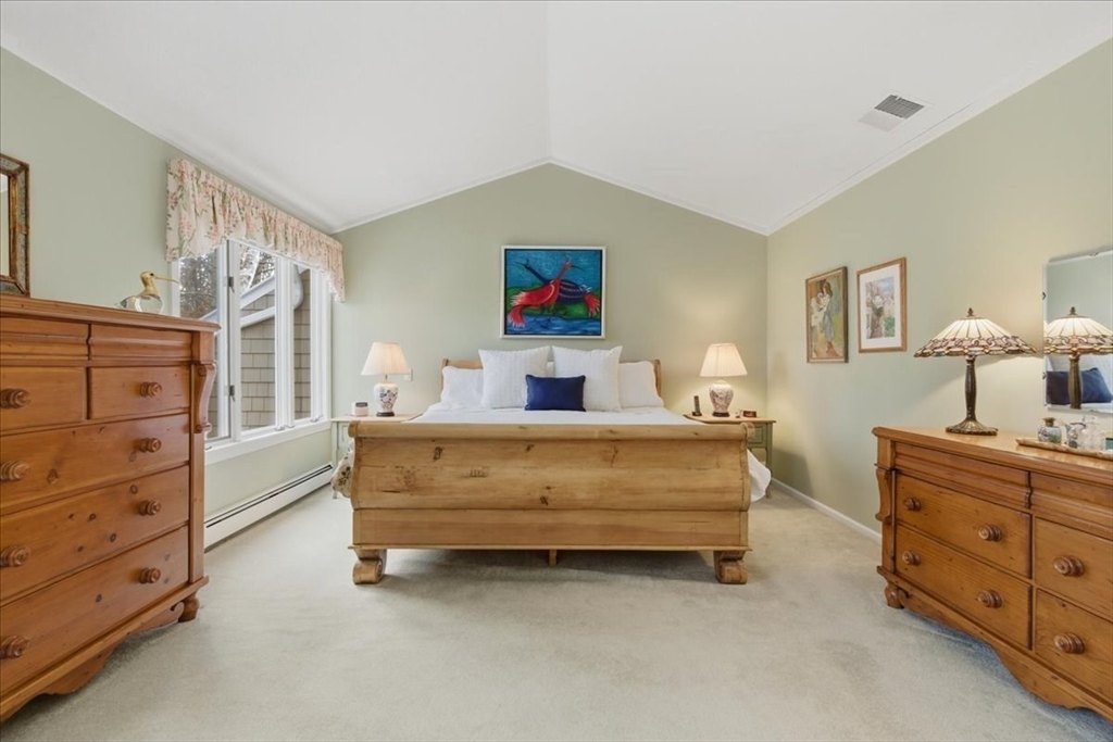 401 Dedham Street, Unit B Newton, MA 02459 - Photo 12 of 33 a bedroom with a bed and a furniture