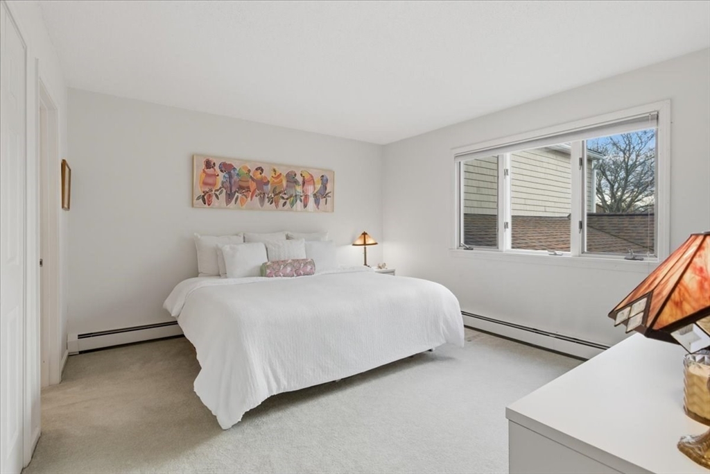 401 Dedham Street, Unit B Newton, MA 02459 - Photo 16 of 33 a bedroom with a bed and a window