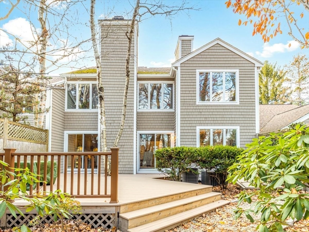 401 Dedham Street, Unit B Newton, MA 02459 - Photo 2 of 33 a front view of a house with a yard