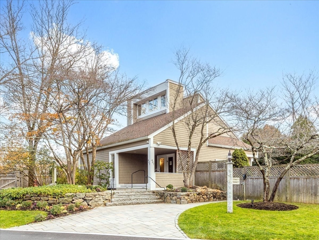 401 Dedham Street, Unit B Newton, MA 02459 - Photo 24 of 33 a view of a white house with a yard