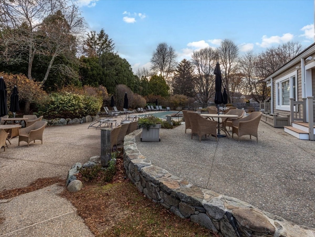 401 Dedham Street, Unit B Newton, MA 02459 - Photo 25 of 33 a view of a backyard with sitting area
