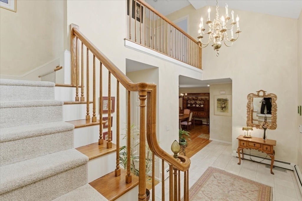 401 Dedham Street, Unit B Newton, MA 02459 - Photo 3 of 33 a view of hall way with furniture and staircase