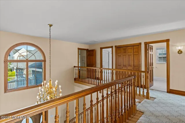 a bedroom with a large bed and a dresser