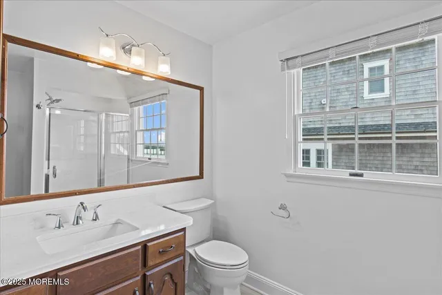 a view of a hallway with windows