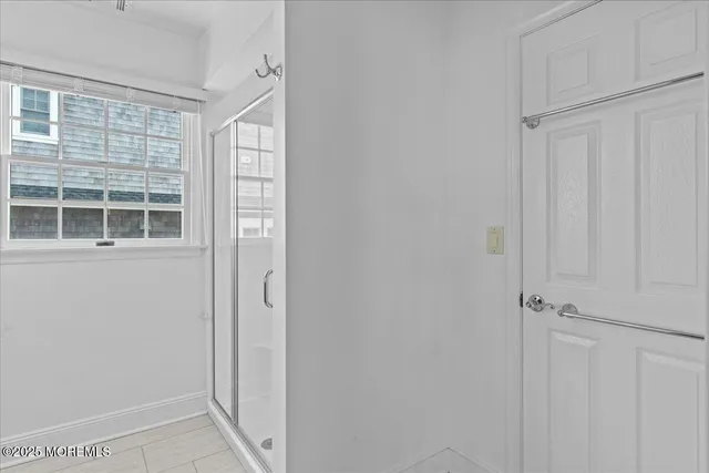 a white toilet sitting next to a window