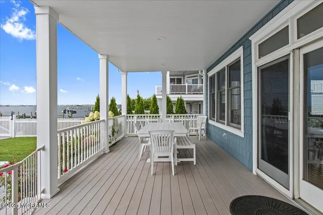 a terrace with outdoor seating and city view