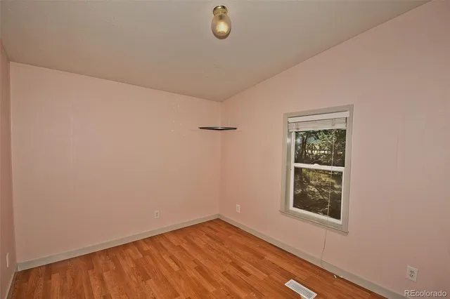 a view of a room that has a window in it